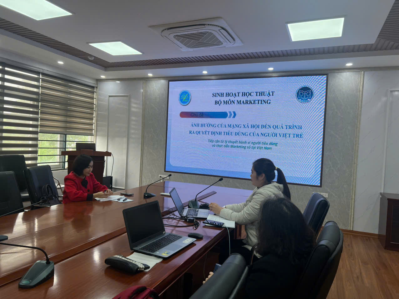 A group of people sitting at a table

Description automatically generated