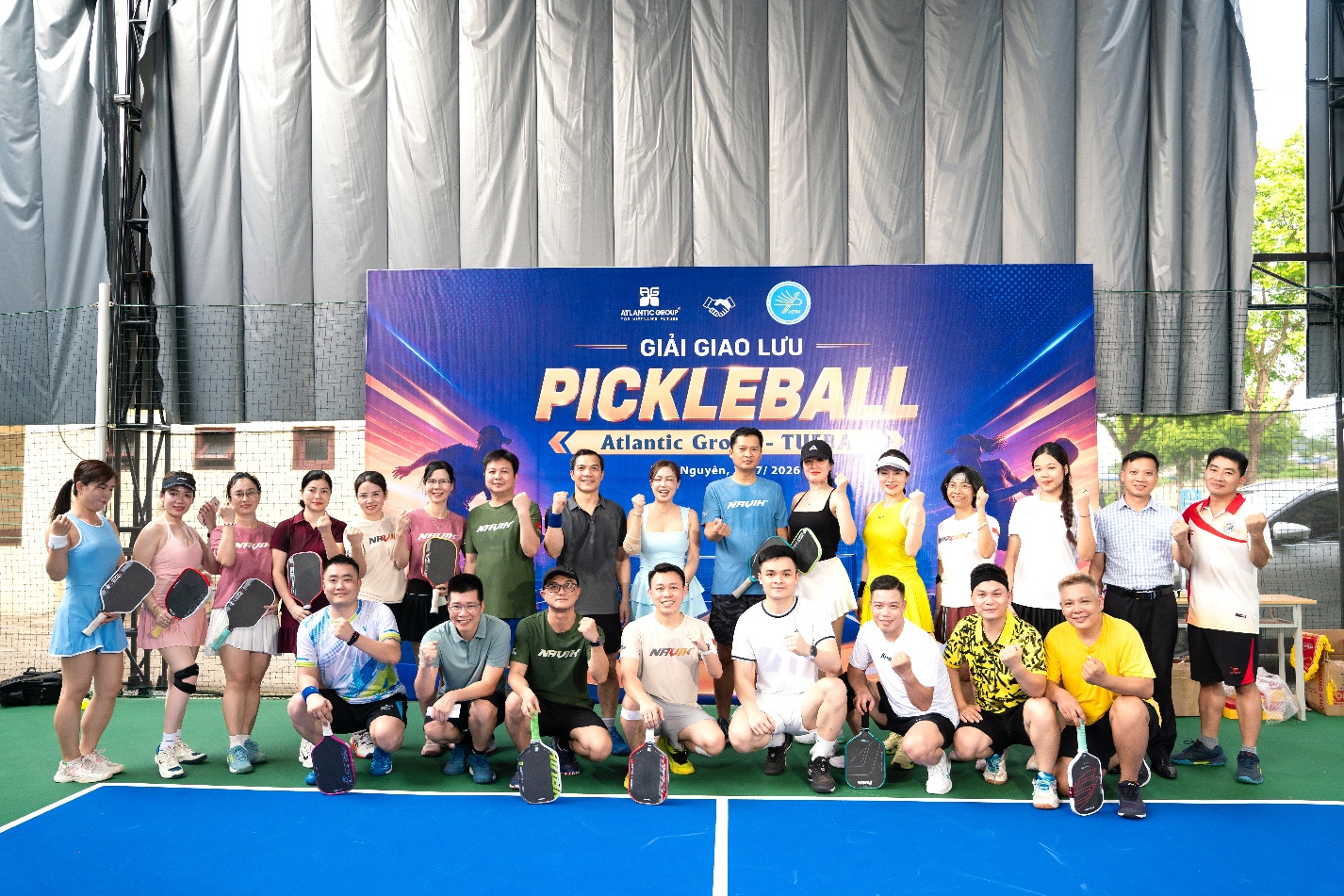 A group of people posing for a photo

Description automatically generated